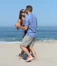 Young couple dancing on sandy beach Royalty Free Stock Photo