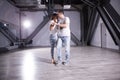 Young couple dancing social danse kizomba in class background. Royalty Free Stock Photo