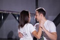 Young couple dancing social danse kizomba in class background. Royalty Free Stock Photo