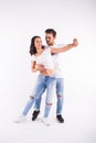 Young couple dancing social latin dance bachata, merengue, salsa. Two elegance pose on white background Royalty Free Stock Photo