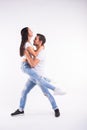 Young couple dancing social latin dance bachata, merengue, salsa. Two elegance pose on white background Royalty Free Stock Photo