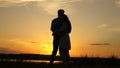 Young couple dancing at sunset on beach. Happy guy and girl waltz in evening in the summer park. Loving man and woman Royalty Free Stock Photo