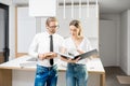 Couple planning home interior in the kitchen Royalty Free Stock Photo