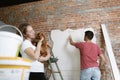 Young couple doing apartment repair together themselves Royalty Free Stock Photo