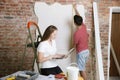 Young couple doing apartment repair together themselves Royalty Free Stock Photo