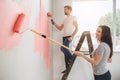 Young couple doing apartment repair together themselves