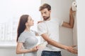 Young couple doing apartment repair together themselves Royalty Free Stock Photo