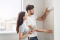 Young couple doing apartment repair together themselves Royalty Free Stock Photo
