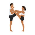 Young couple doing Extended Hand to Big Toe yoga pose, Utthita Hasta Padangushthasana Royalty Free Stock Photo