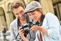 Young couple doing photo reportage