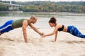 Young couple doing sports training on the beach Royalty Free Stock Photo