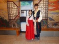 A young couple dressed in Hanbok, traditional Korean dress in a palace in Seoul