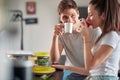 A young couple drinking a coffee before breakfast at home. Couple, relationship, breakfast, together Royalty Free Stock Photo