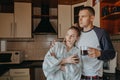 Young couple drinking coffee in kitchen at home in the morning. Young happy couple, newlyweds family start new day and