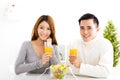 Young couple drinking juice and healthy food Royalty Free Stock Photo