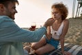 Young couple drinking red wine and eating srawberries Royalty Free Stock Photo