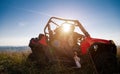 Young couple driving a off road buggy car Royalty Free Stock Photo