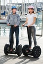 Couple driving segways