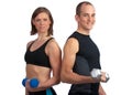 Young couple with dumbells Royalty Free Stock Photo