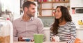 Young Couple Eating Breakfast In Kitchen Together Royalty Free Stock Photo