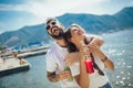 Couple eating fruit on the beach- summer party with friends and healthy food concept Royalty Free Stock Photo