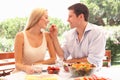 Young couple eating outdoors Royalty Free Stock Photo