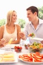 Young couple eating outdoors Royalty Free Stock Photo