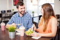 Young couple eating together and flirting