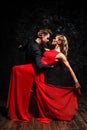 Young couple in elegant evening dresses dancing Royalty Free Stock Photo