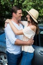 Young couple embracing by car Royalty Free Stock Photo