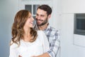 Young couple embracing at home Royalty Free Stock Photo