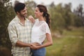 Young couple embracing at olive farm