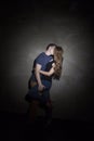 Young couple embracing over gray background Royalty Free Stock Photo