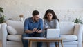 Young couple engaged in family budget control and financial management