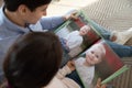 Young couple enjoy childhood kid photos in album Royalty Free Stock Photo