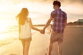 Young couple enjoying a beach walk Royalty Free Stock Photo