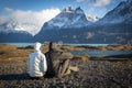 Young couple enjoying the a beautiful scenario in Torres del Paine National Park, Patagonia, Chile Royalty Free Stock Photo