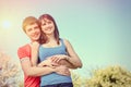 Young couple enjoying in blooming garden Royalty Free Stock Photo