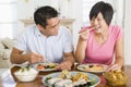 Young Couple Enjoying Chinese Food