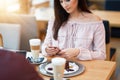 Young Couple Enjoying Coffee And Cake In Cafe Royalty Free Stock Photo