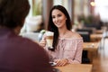 Young Couple Enjoying Coffee And Cake In Cafe Royalty Free Stock Photo