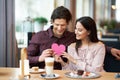 Young Couple Enjoying Coffee And Cake In Cafe Royalty Free Stock Photo