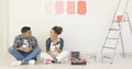 Young couple enjoying coffee while renovating Royalty Free Stock Photo