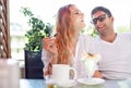 Young couple enjoying coffee at a street cafe Royalty Free Stock Photo