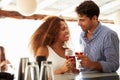 Young Couple Enjoying Drink At Outdoor Bar Royalty Free Stock Photo