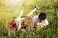 Young loving couple enjoying nature, holding hands and walking on the field with lavender. Beautiful people on nature in spring at Royalty Free Stock Photo