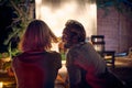 A young couple enjoying a night cinema in the bar at the river bank. Night, summer, bar, river Royalty Free Stock Photo