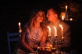 Young couple enjoying a romantic dinner by candlelight, outdoor Royalty Free Stock Photo