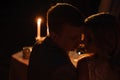 Young couple enjoying a romantic dinner by candlelight, outdoor Royalty Free Stock Photo