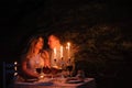 Young couple enjoying a romantic dinner by candlelight, outdoor. Royalty Free Stock Photo